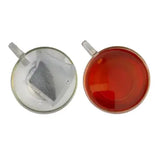 Clear glass teacups with handles show miles tea smugglers gold teabags brewing rich red ceylon tea