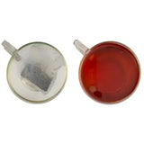 Two clear glass teacups showing miles west country original teabags with white tea bag and amber english breakfast tea