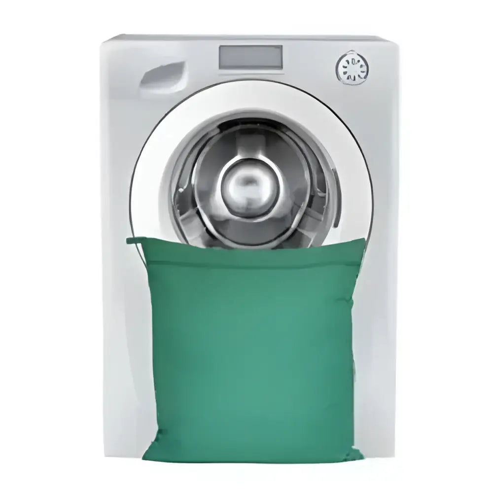 Green fabric moorland rider petwear wash-bag small placed in front of white front-loading washing machine