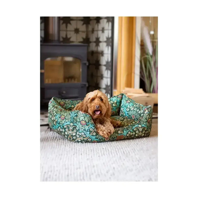 A plush teal and green floral blackthorn print square bed with a soft cushioned interior for dogs