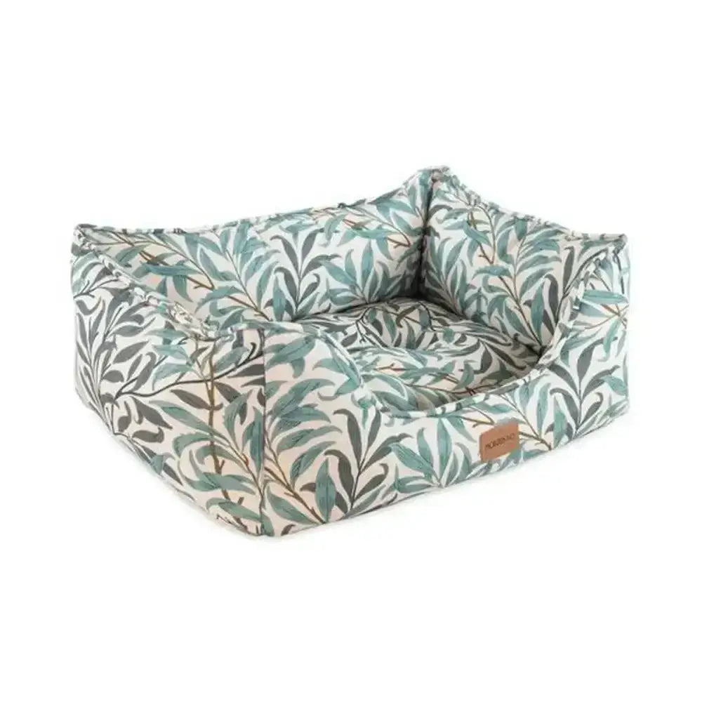 A cozy rectangular pet bed upholstered in soft fabric with morris & co willow boughs print in green and gray on cream