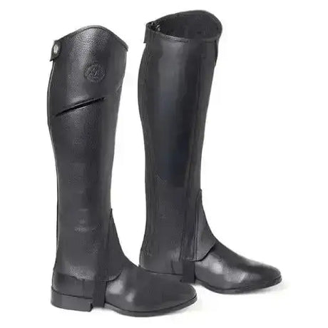 Black leather riding boots with glossy finish and reinforced stitching from mountain horse renown horse renown leggings