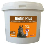 White plastic bucket of naf biotin plus powder with orange label and black horse for healthy hooves and hoof supplements