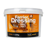 A white plastic tub of naf five star profeet farrier dressing 2.5kg for horse hooves with orange and black label