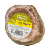 A pink himalayan salt lick wrapped in clear plastic with a yellow and white naf himalayan salt label