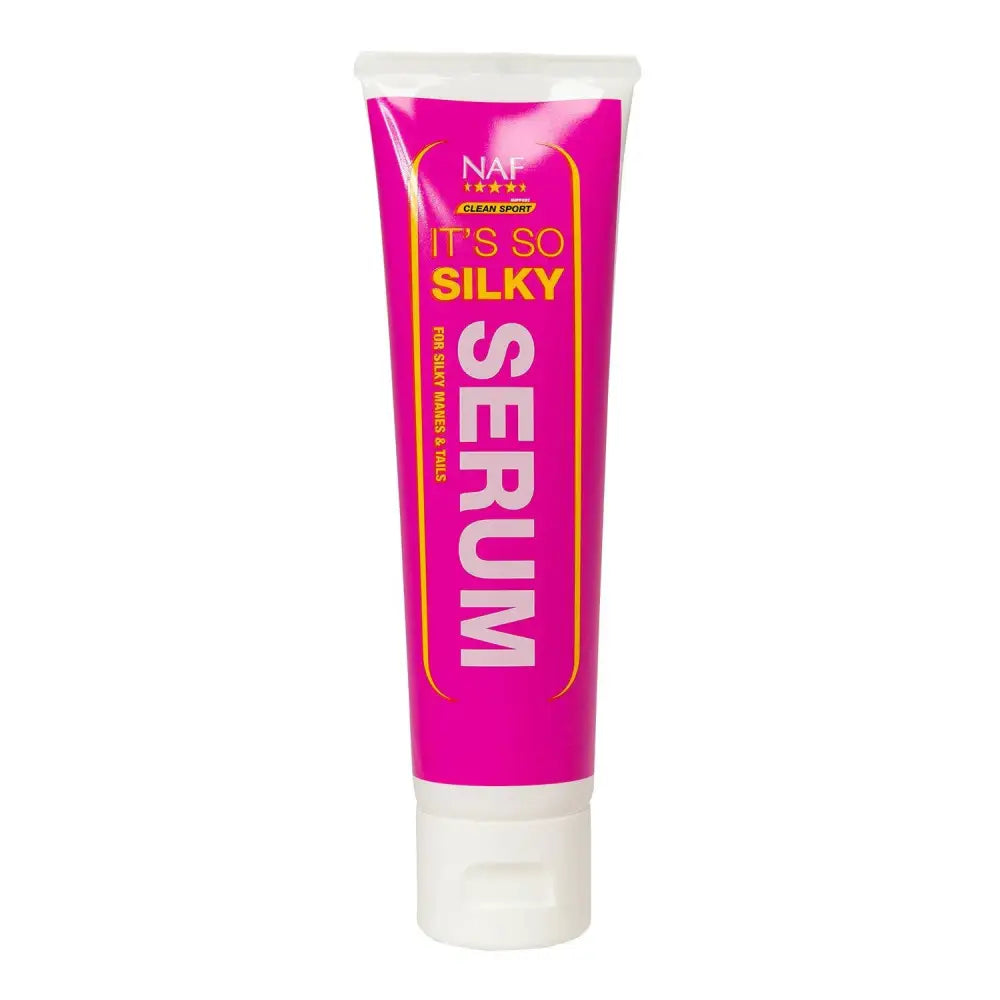 Bright pink tube of naf its so silky serum with white cap designed for silky hands and nails with abyssinian oil