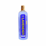 A translucent lavender naf lavender wash bottle with gold spray nozzle and blue label with bold yellow text for horse washes