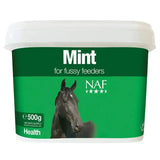 Green and white plastic container of naf mint horse supplement designed to boost appetite for fussier feeders