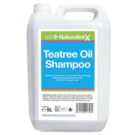 White plastic jug of naf naturalintx tea tree antibacterial tea tree oil shampoo with handle and screw-top cap 5 liters