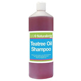 A clear plastic bottle with a white cap of purple naf naturalintx tea tree oil shampoo antibacterial formula