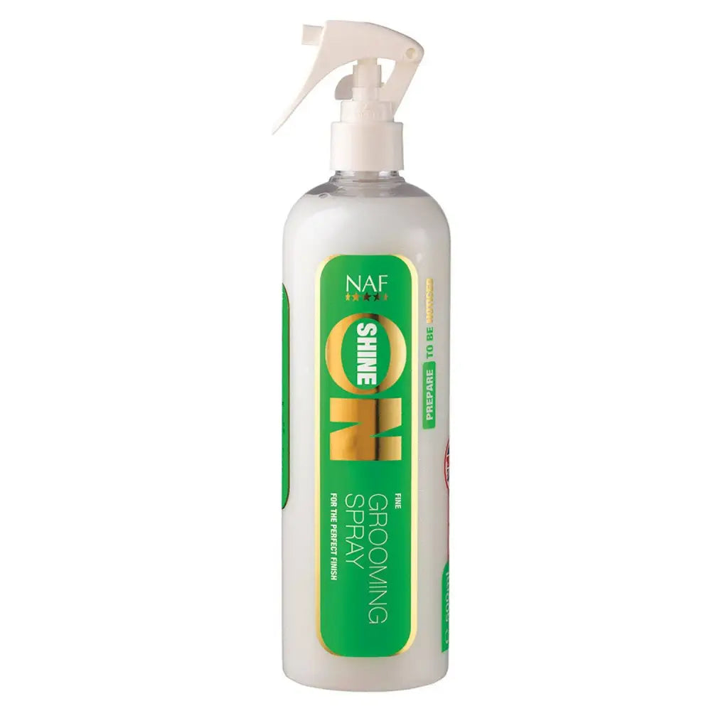 White plastic naf shine grooming spray bottle with green and gold label for perfect coat shines and finish