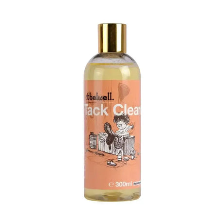 A clear bottle with gold cap of naf thelwell tack clean containing amber liquid and orange cartoon label