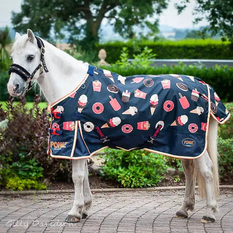 Navy blue horse rug with playful food-themed print and contrasting pink, white, and red accents