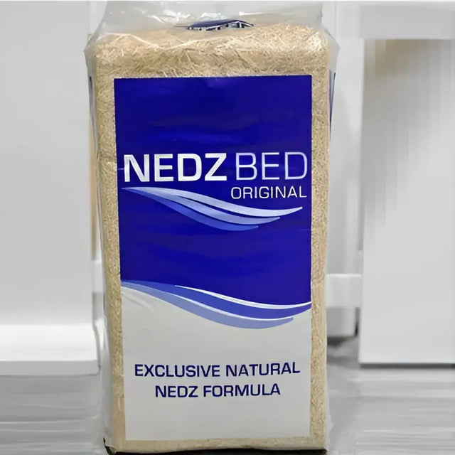 A 20 kg package of nedz bed original bedding material with a blue and white wavy label design