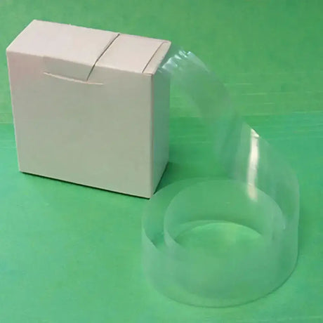 Clear plastic pack protective sleeves beside white cardboard box for neogen chemise sanitary insemination rods