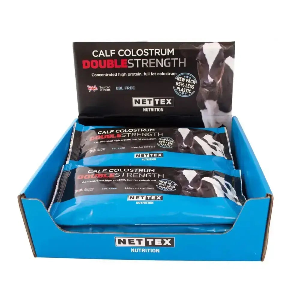 Blue cardboard display box with nettex agri calf colostrum double strength fat colostrum supplement bars inside