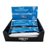 Blue and white packed nettex agri calf colostrum fat colostrum supplement sachets in a black display box