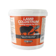 Orange and white plastic tub of nettex agri lamb colostrum easy mix colostrum blend high energy feed for lambs