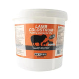 White plastic tub of nettex agri lamb colostrum with orange label featuring easy mix lamb colostrum blend design
