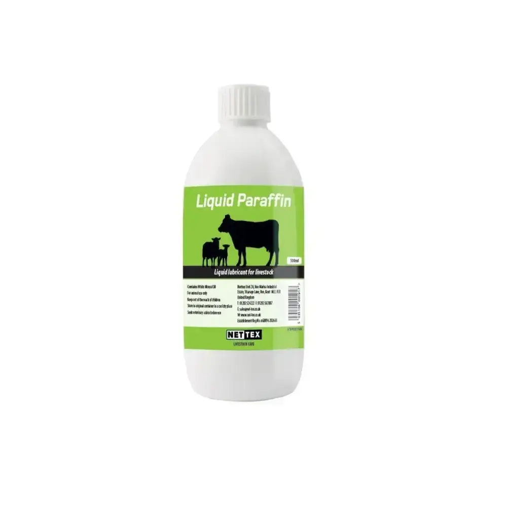 White plastic bottle of nettex agri liquid paraffin 500ml with green label and black cow silhouettes pure medicinal quality quality liquid laxative