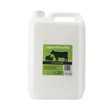 White plastic jerrycan of netex nettex agri liquid paraffin with green label featuring black cow silhouettes quality liquid laxative