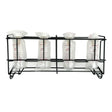 Black metal rack holding four clear plastic lamb feeder bottles sealed in bags with white caps nettex agri non-vac system