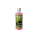 Pink antibacterial skin cleansing liquid in a clear bottle with a green label featuring black cows by nettex agri veterinary surgical scrub