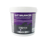 White plastic tub of nettex equine gut balancer supplement with purple and black label featuring natural yeast formulation