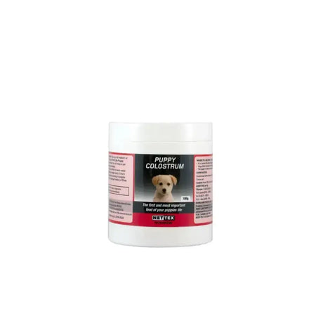White cylindrical container of nette first life puppy colostrum 180g colostrum derived supplement for bitches colostrum