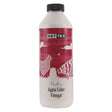 A white plastic bottle with a black cap and red label of nettex poultry apple cider vinegar natural supplement produced for chickens