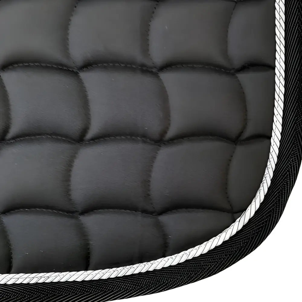 Quilted black dressage saddle pad with white piping from NEW GALLOP for optimal style