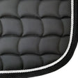 New galop black quilted dressage saddle pad with white rope trim featuring contoured spine and anti-rub girth pad