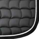 New galop black quilted dressage saddle pad with white rope trim featuring contoured spine and anti-rub girth pad
