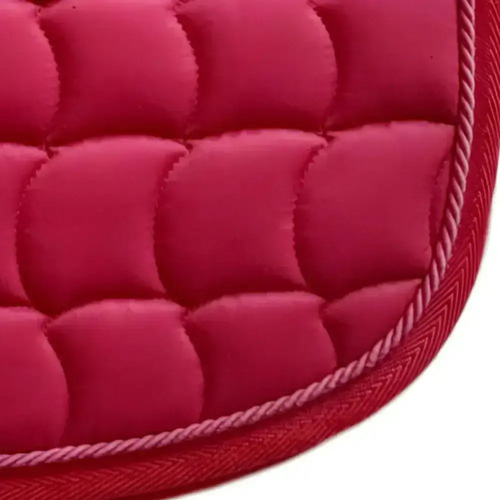Vibrant fuchsia new gallop quilted close contact gp pad with stitched rope border and contoured spine design