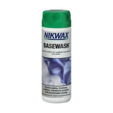 Nikwax basewash is a white bottle with a green cap containing a deodorising cleaner for synthetic technical underwear and socks