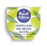 The real olive company nocellara del belice whole olives in cold-pressed oil in white container with green olive design
