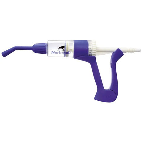 Purple plastic norbrook dosing gun with clear barrel 75ml marked norbrook and black bull logo for vet use