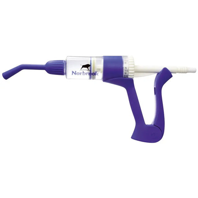 Purple plastic norbrook dosing gun with clear barrel 75ml marked norbrook and black bull logo for vet use