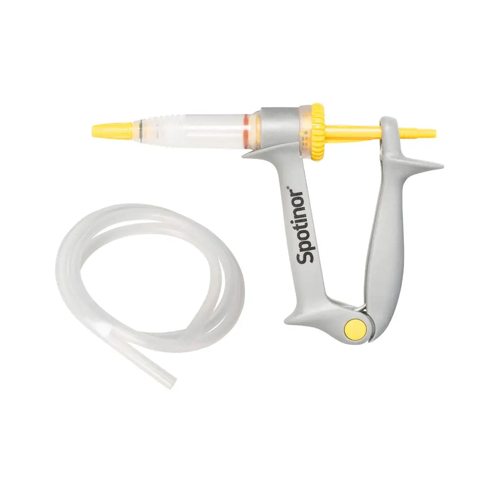 Gray and yellow norbrook spotinor dosing gun with clear barrel and coiled transparent tube for easy application