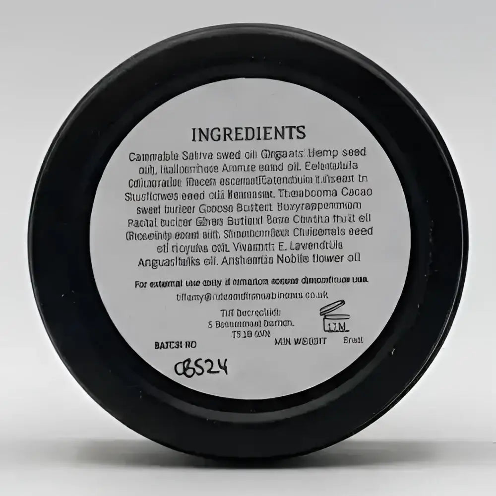 Back of north devon honey luxury beeswax fragranced solid cream bar showing white ingredient label on black container