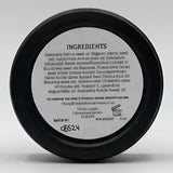 Back of north devon honey luxury beeswax fragranced solid cream bar showing white ingredient label on black container
