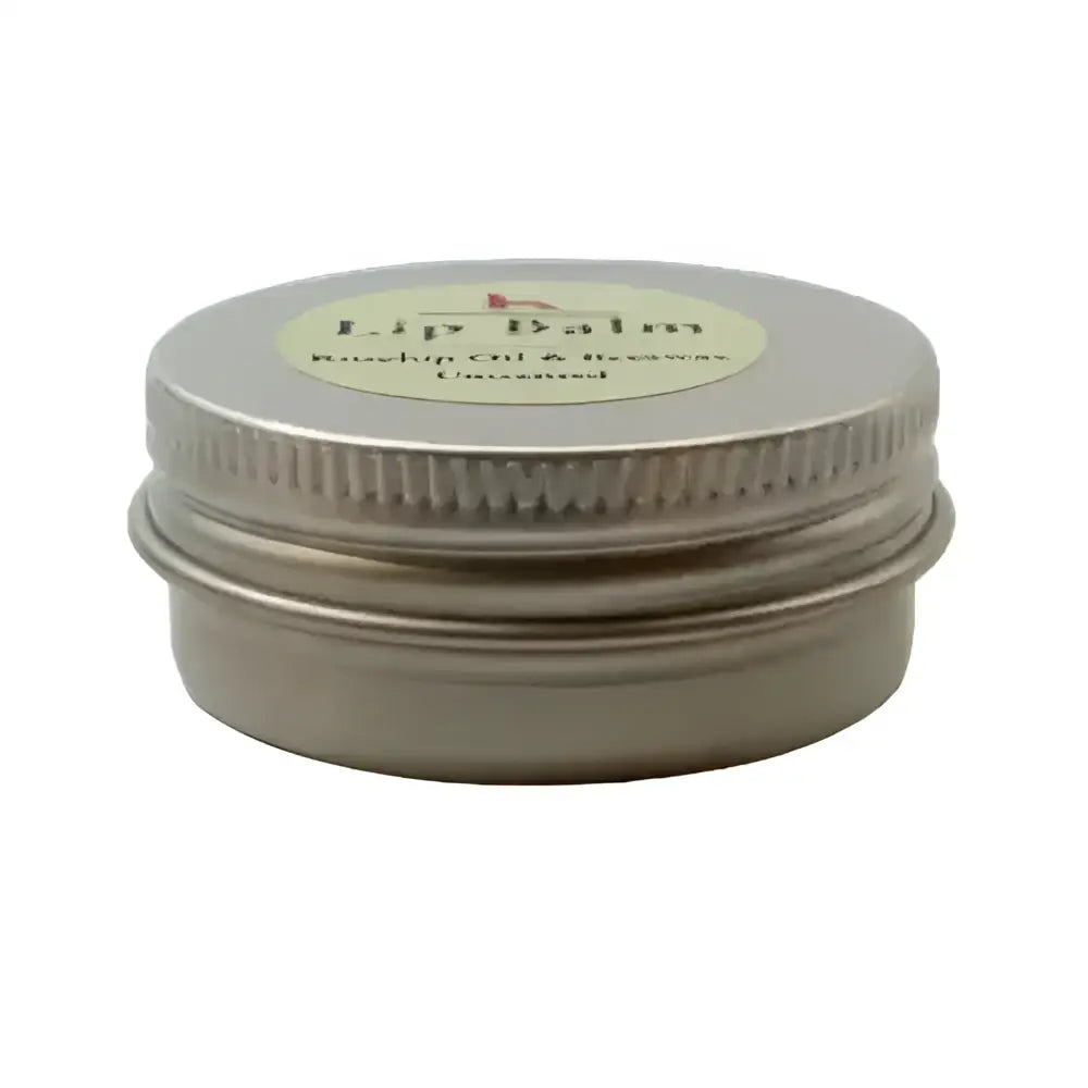 Silver tin container with ribbed lid and beige label north devon honey luxury beeswax lip balm for smooth lips