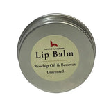 A round silver tin of north devon luxury beeswax lip balm with rosehip oil from ham hill honeybees unscented