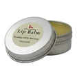 Silver tin with beige label showing ingredients for north devon honey luxury beeswax lip balm with rosehip oil
