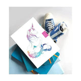 A white notebook mythical merhorse with a colorful unicorn mermaid tail illustration perfect for pocket sized notebooks