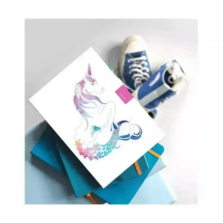 White notebook mythical unicorn with colorful unicorn and mermaid illustration in iridescent rainbow hues, pocket sized notebook