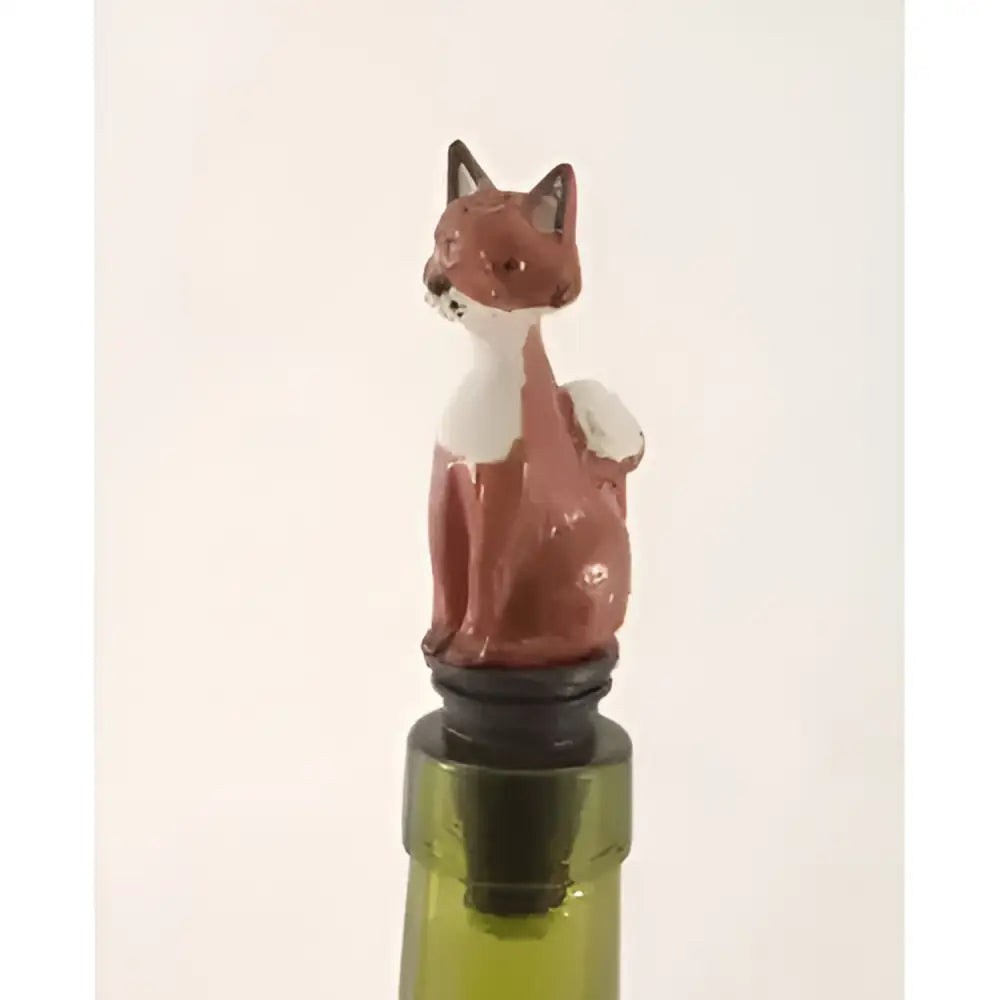 A charming red and white painted fox bottle saver novelty wine stopper with a glossy finish for wine bottles