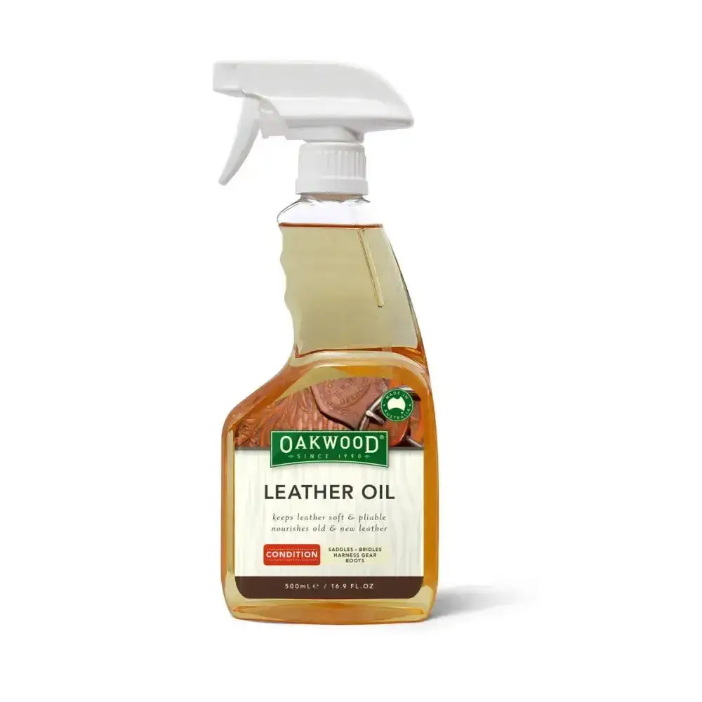 Oakwood leather oil in a clear spray bottle with white trigger nozzle containing amber leather oil for tack accessories care