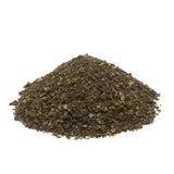 A mound of dark brown coarse-ground pepper flakes in omega equine seaweed natural nutrients seaweed supplement