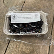 A clear plastic-wrapped package of organic blackcurrants from amary farm grown in lincombe north devon great for equestrian horses